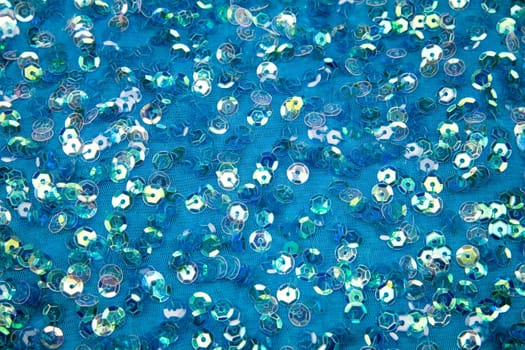 Bright spangles on a blue celebratory fabric