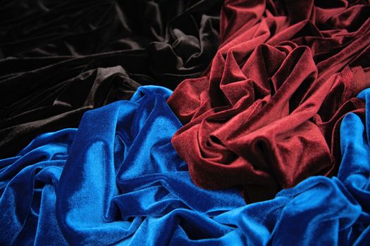 blue red and black glossy velvet is formative folds and light-shadow picture