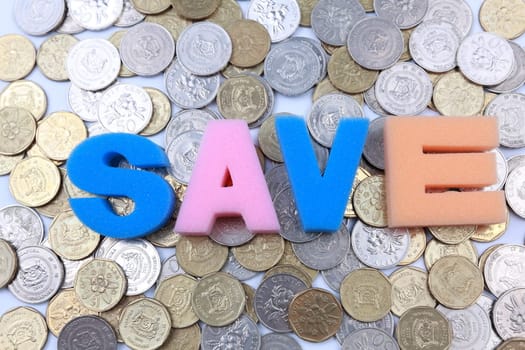 Save word spelled out on a backdrop of coins