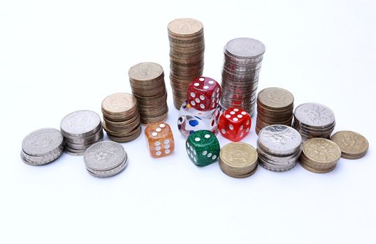Dices surrounded by coins