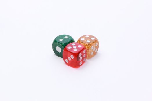 3 coloured dices on white background