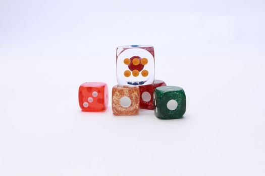 5 coloured dices on white background