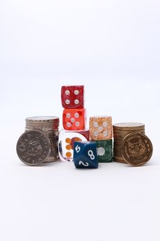 6 coloured dices with coins on white background