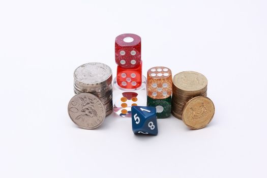 6 coloured dices with coins on white background