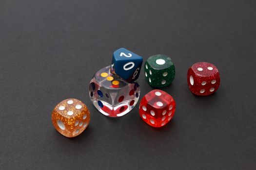 6 coloured dices on dark background