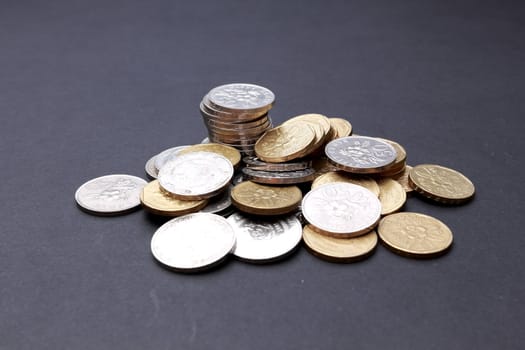 Gold and silver coins on dark background