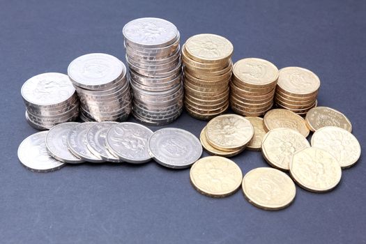 Gold and silver coins on dark background