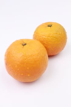 A pair of fresh oranges.