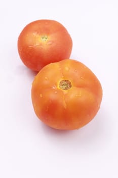 A pair of fresh tomatos
