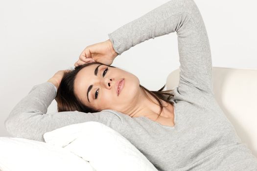 Beautiful woman on sofa at home