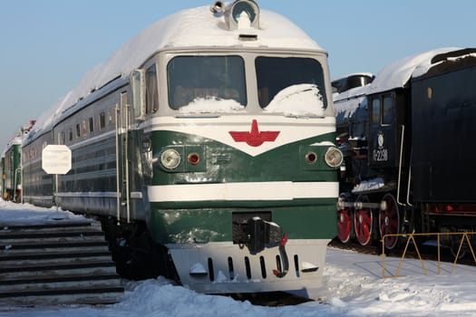 diesel locomotive at the station  in winter, front view