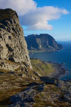 Scenic coastal cliffs on island of Vaeroy, Lofoten islands in Norway