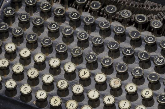 old typewriter with black and white keys