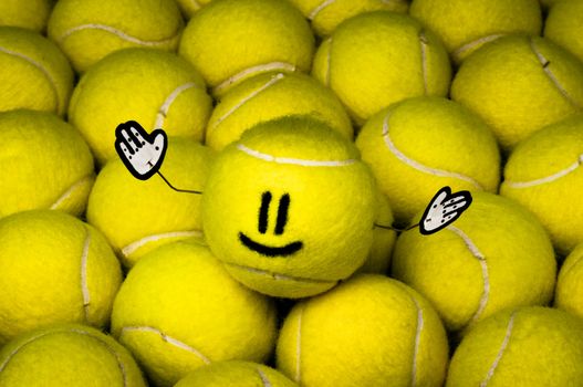 Smiley leader of all yellow tennis balls, metaphor