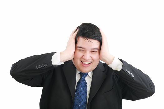 Frustrated young businessman pulling his hair, studio shot