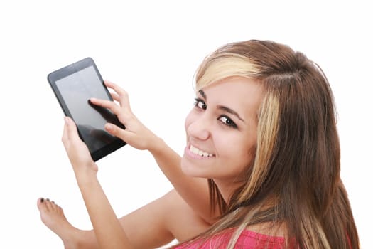 Overhead photograph of a beautiful young women sitting on floor using a tablet PC computer and smiling