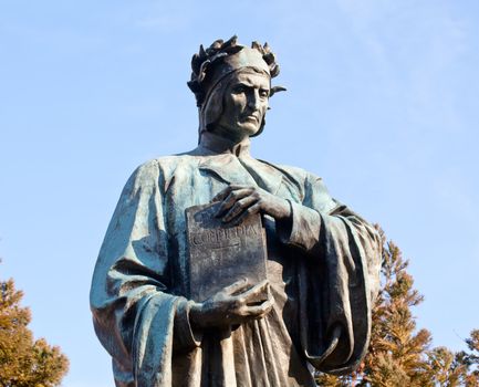 Statue of Dante holding Commedia book in Meridian Hill Park in Washington DC