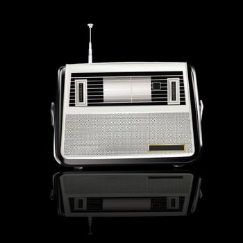 Retro a radio receiver over black background