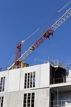 Construction site with crane in blue sky