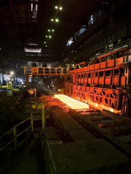 hot steel on conveyor inside of plant