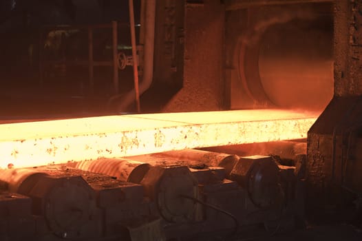 hot steel on conveyor inside of plant