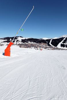 snowmaker on ski track in french alps