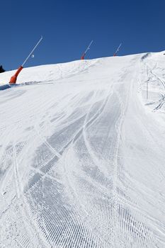 snowmaker on ski track in french mountain 