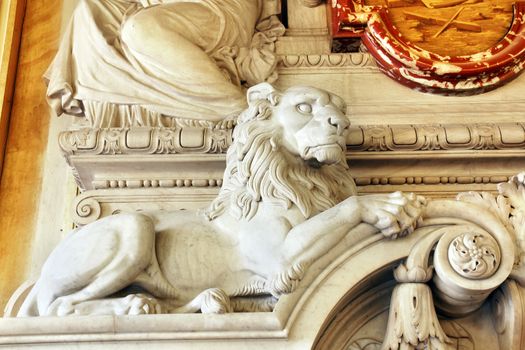 Magnificent sculpted lion part of a marble fireplace mantle of an historical european building, hotel de ville de Lyon, France.