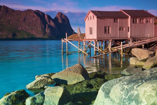 Old abandoned fishing port by the fjord on Lofoten islands in Norway