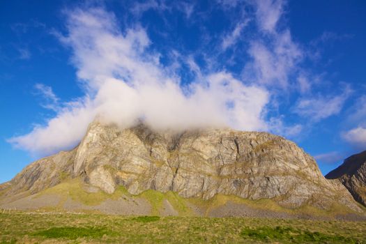 Scenic coastal cliffs on island of Vaeroy, Lofoten islands in Norway