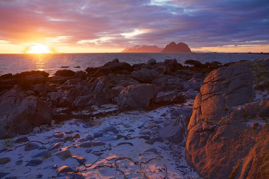 Scenic view of midnight sun on the beach of Lofoten islands in Norway