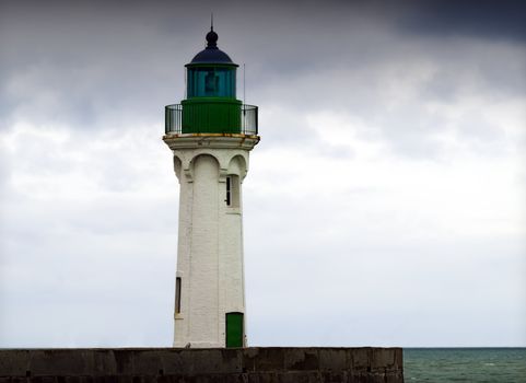 a lighthouse at the harbor entrance