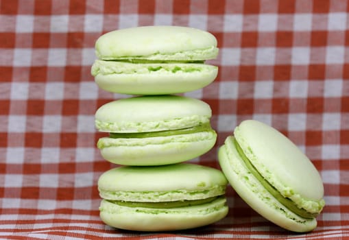 green macaroons on checkered background