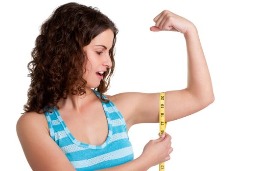 Surprised woman measuring her Biceps, isolated in a white background