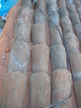Working on a roof at a building site