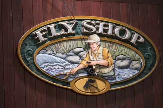 wooden fly shop sign