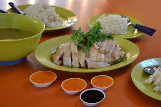 Thai gourmet steamed chicken and  rice served with delicious soup and sauce