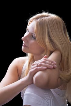 Portrait of a beautiful blonde on a dark background