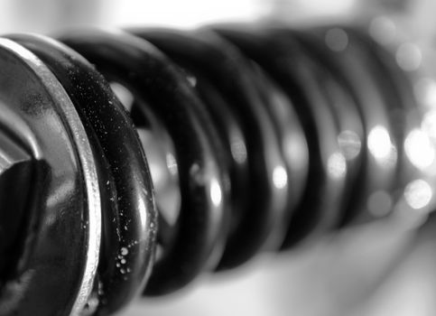 Close up of a coil spring with shallow depth of field