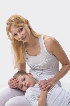 Mother and son do yoga before bed 