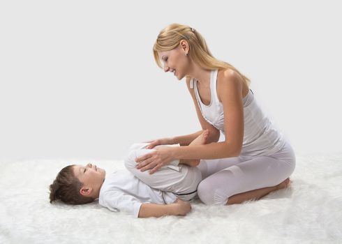 Mother and son do yoga before bed