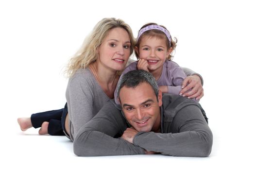 Studio shot of parents with their daughter