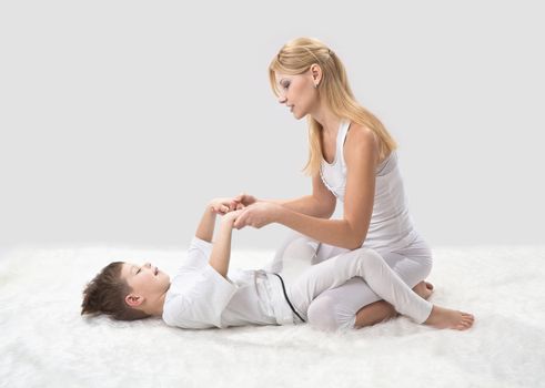 Mother and son do yoga before bed