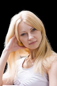 Portrait of a beautiful blonde on a dark background 