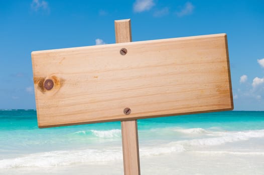 Wood sign in the beach, with clipping path.