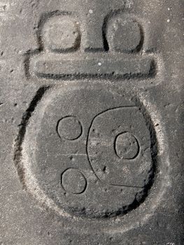 Mayan glyph carved in stone, Nim Li Punit archaeological site, Belize.
