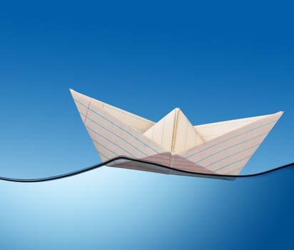 illustration of  paper boat on the ocean.