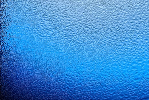 water drops on glass, color blue. 