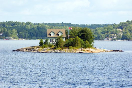 Lone cottage on stone small island