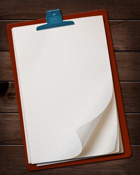 Old note paper block on wood background.